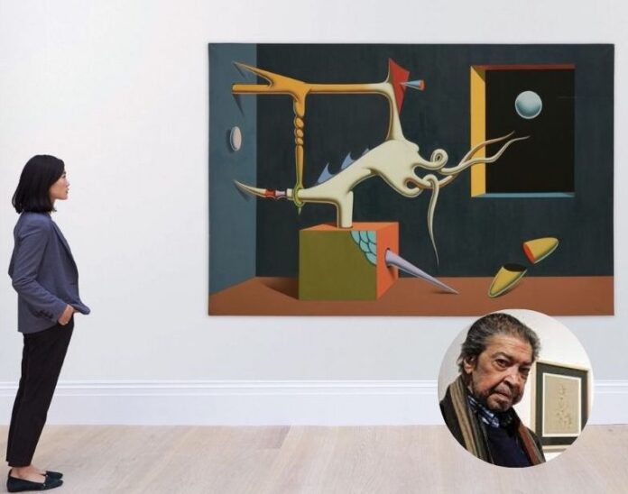 El artista Iván Tovar y una de sus obras.